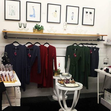 A display of clothing and objects inside the boutique