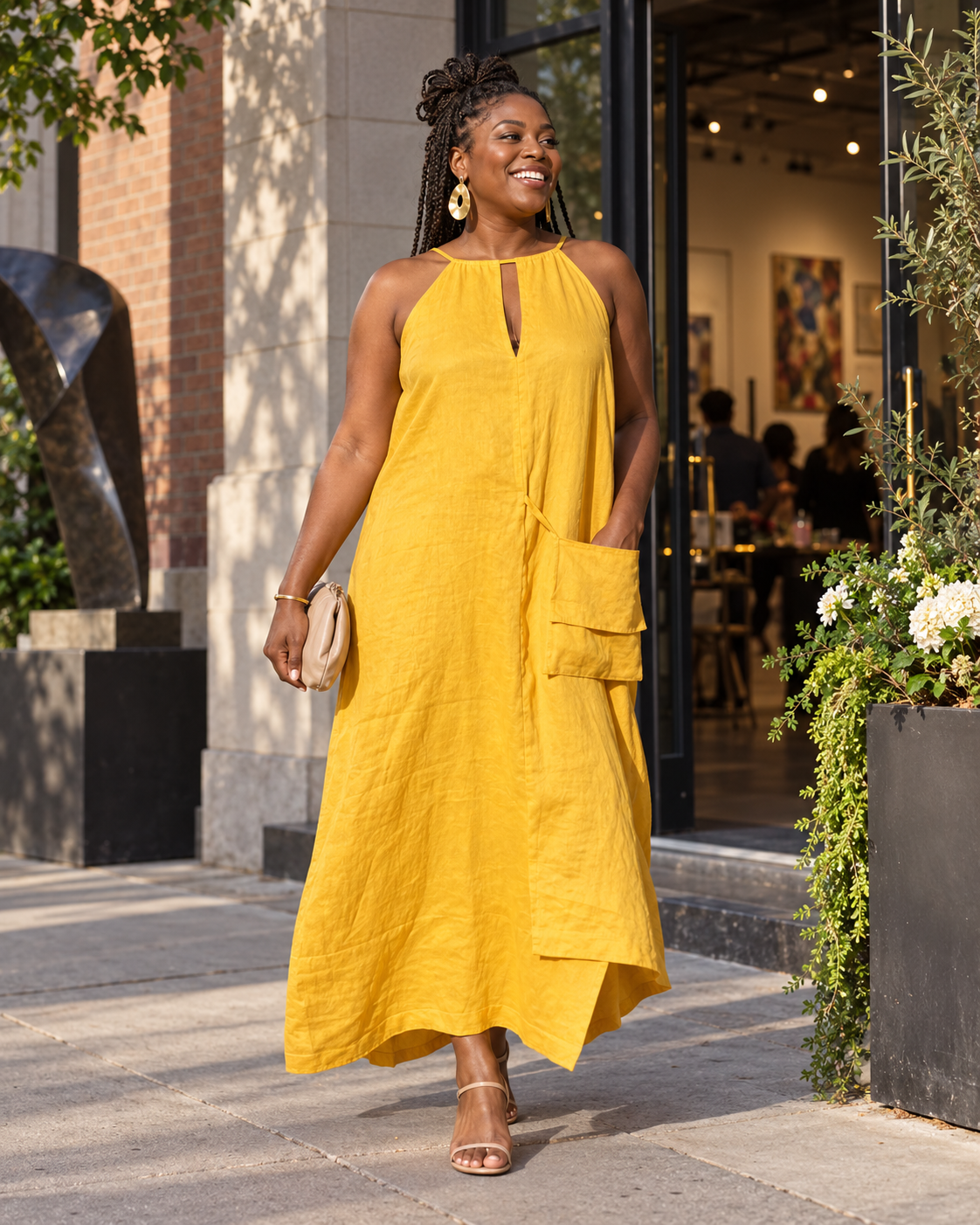 A confident customer wearing the mustard-yellow linen dress available through Wilkes and Bowens