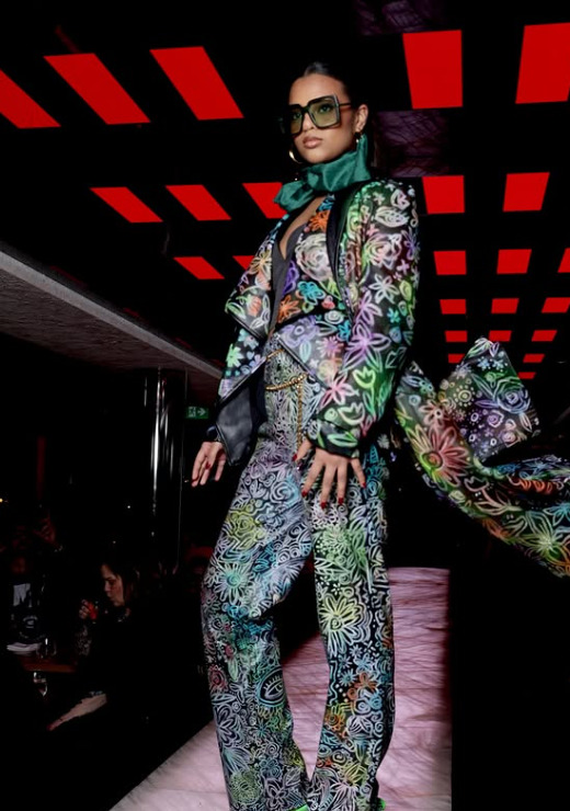 A Canadian designer runway look with colourful pattern and dramatic movement